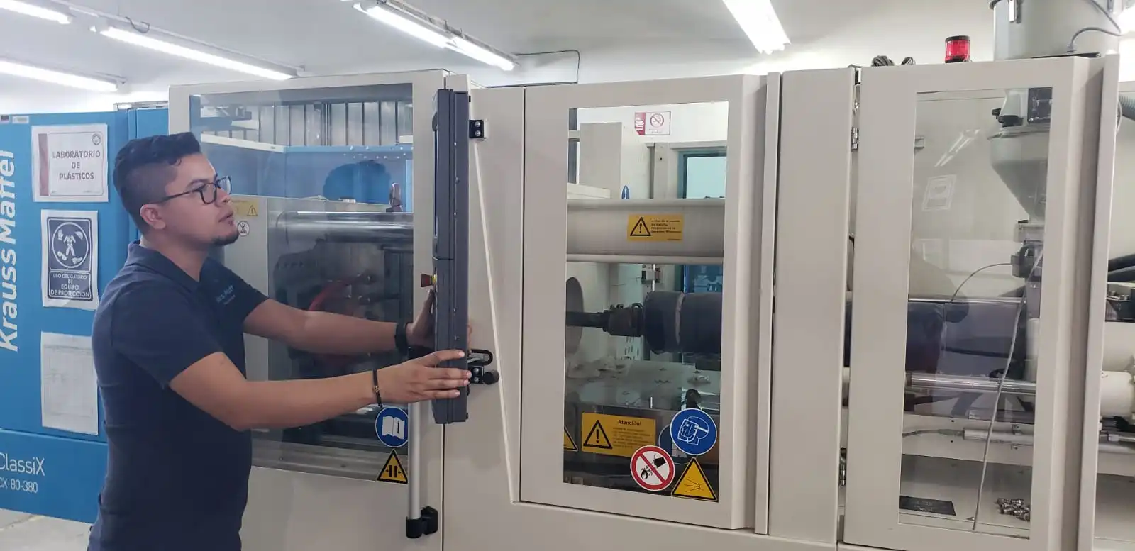Technician working with industrial machinery